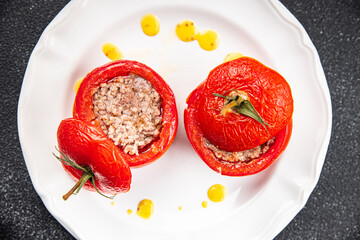 tomato meat stuffed pork, beef, chicken filling tomatoes baked vegetable food meal food snack on the table copy space food background rustic top view 
