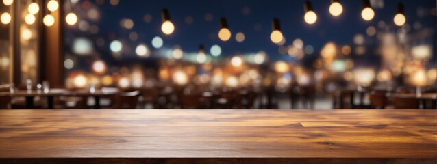 Naklejka premium Empty wooden table top with lights bokeh on blur restaurant background.