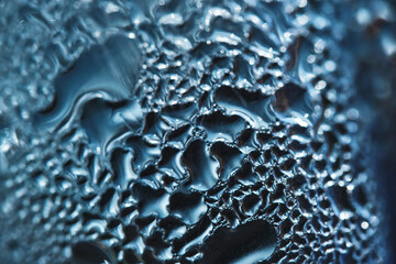 Abstract blue background with drops misted glass.