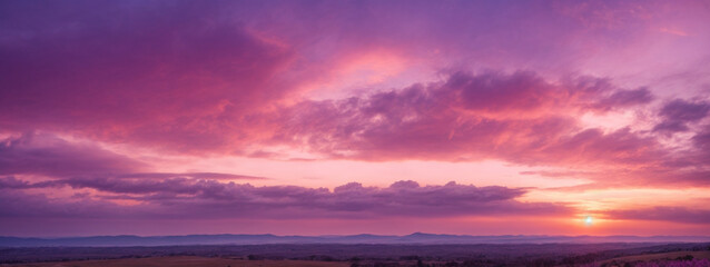 Fototapeta premium Panoramic view of a pink and purple sky at sunset. Sky panorama background.