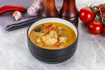 Traditional yellow Thai curry with chicken