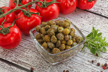 Marinated green capers in the bowl