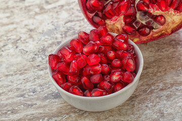 Ripe red Pomegranate seeds in the bowl