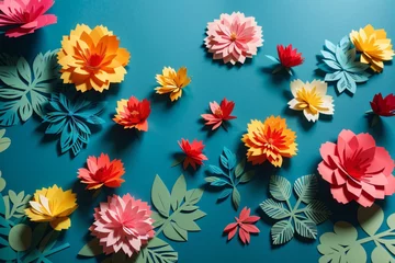 Foto op Aluminium top view of colorful paper cut flowers with green leaves on blue background with copy space © @uniturehd