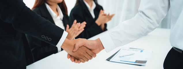 Business people group handshake at meeting table. Job interview success or making successful...