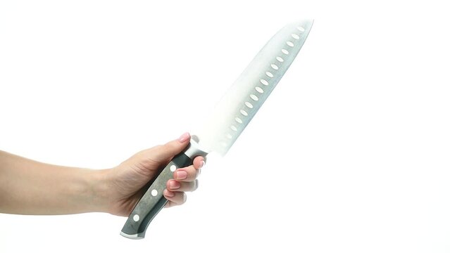Kitchen knife in woman female hand on a white background isolation