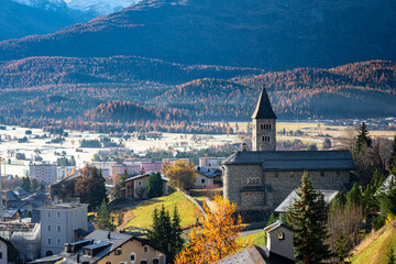 Church of the town of Samedan in the Engadin Valley on a sunny early morning in late October