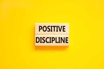 Positive discipline symbol. Concept words Positive discipline on beautiful wooden blocks. Beautiful yellow table yellow background. Business psychology positive discipline concept. Copy space.