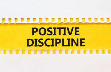Positive discipline symbol. Concept words Positive discipline on beautiful yellow paper. Beautiful white table white background. Business psychology positive discipline concept. Copy space.