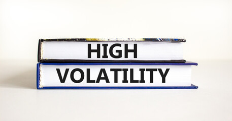 High volatility symbol. Concept words High volatility on beautiful books. Beautiful white table white background. Business high volatility concept. Copy space.