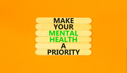 Mental health psychological symbol. Concept words Make your mental health a priority on wooden...