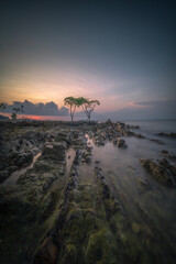 Tropical beach at sunset in Bintan Island, Indonesia.