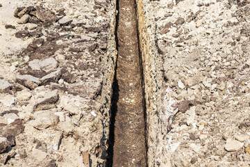 Long trench for laying water supply and sewage system pipes