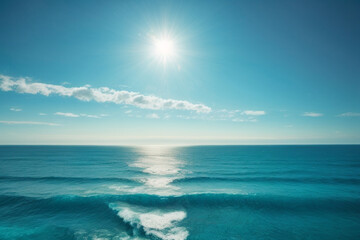 Obraz premium Blue ocean panorama with sun reflection, The vast open sea with clear sky, Ripple wave and calm sea with beautiful sunlight