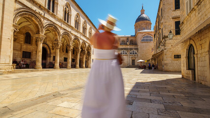 a woman travels through the streets of the old town Dubrovnik, Croatia, medieval European architecture, the concept of traveling through the Balkans