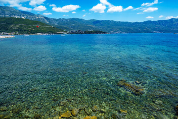 sea, sun and rocky shore, seascape of summer holidays, a beautiful seaside resort, a beach, a city in the distance and hotels on the mountainside, Adriatic Sea