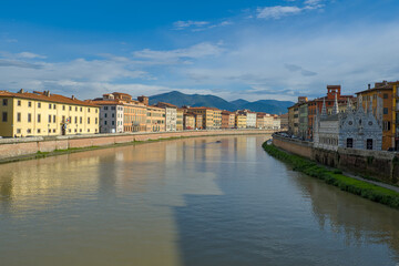 View on the Arno river and old town of Pisa