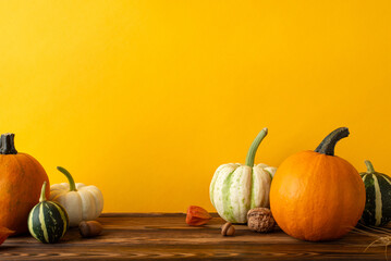 Get into the harvest spirit! Side view shot of a wooden table adorned with a variety of autumn...