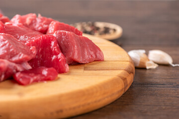 Soft focus on beef or lamb meat on a cutting board.