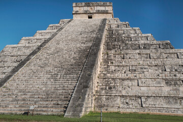 Fototapeta na wymiar Mexico, Dez 2017. The Chichen Itza Pyramid or The Kukulkan Pyramid, or The Castle, it is the major structure in the archaeological zone, built around 960 AD and elected among 7 Wonders of the World. 