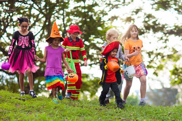 Kids trick or treat. Halloween fun for children.