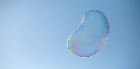 Sky's Jeweled Adornment: Capturing a Soap Bubble