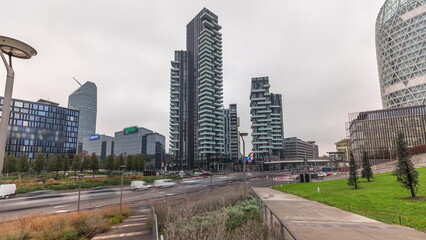 Obraz premium Panorama showing skyscrapers and biblioteca from park with green lawn timelapse in Milan