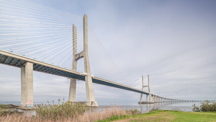 Architectural landmark Vasco da Gama Bridge over the Tagus River in Lisbon, Portugal.