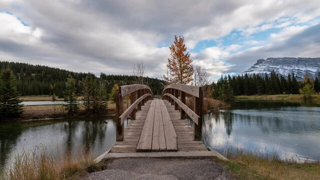 Beautiful Cascade ponds with wooden bridge and mount Rundle in autumn at Banff national park