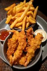 Dutch snacks for beer or wine, french fried potato chips and deep fried tempura shrimps and hot dip sauce