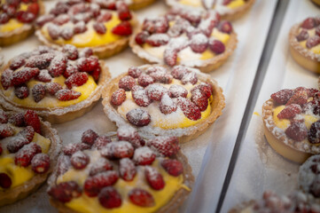 Wild fragolino strawberry and raspberry cakes in ancient city of strawberry Nemi, Castelli Romani, Italy close up