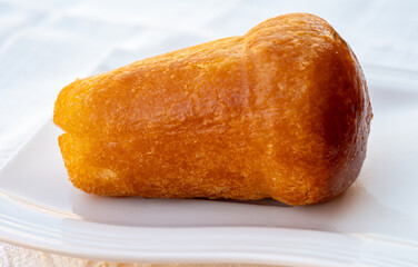 Fresh baked italian dessert homemade rum baba soft cake close up