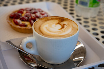 Fresh brewed coffee cappuccino in italian bar, in white cup, morning coffee