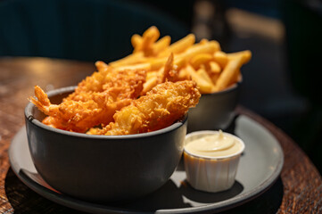 Dutch snacks for beer or wine, french fried potato chips and deep fried tempura shrimps and hot dip sauce