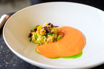 Exquisite dish of modern French haute cuisine prepared with fresh organic ingredients from restaurant own garden and farm and beautifully served