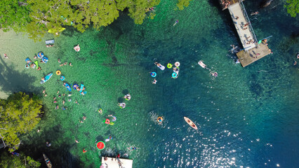Inflatable watermelon float, deck jumping, people enjoy swimming, kayaking, relax in turquoise blue...