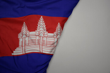 big waving national colorful flag of cambodia on the gray background.