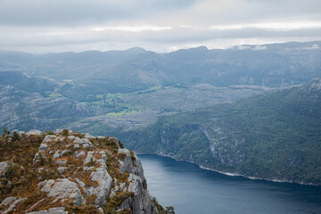 Fototapeta na wymiar landscape with river and mountains on hike in Norway on fjord