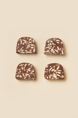 Traditional portuguese dessert Salame de Chocolate on beige background in minimal style. Restaurant bakery menu