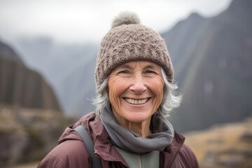 Fototapeta na wymiar Lifestyle portrait photography of a pleased woman in her 50s that is wearing a warm beanie or knit hat at the Machu Picchu in Cusco Peru