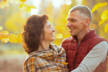 happy romantic couple in park hugging