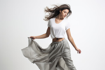 Naklejka premium Professional dancer in stylish clothing dancing on white background