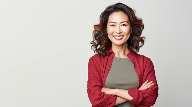 portrait of a smiling senior woman on white studio background