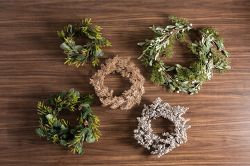 Christmas wreaths set on a wooden background, Top view, Flat lay.