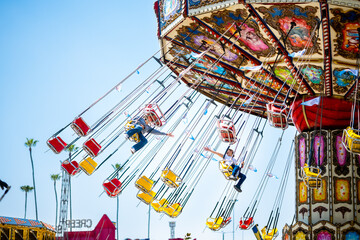 A colorful fair swinging ride.
