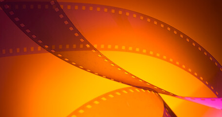 orange yellow color background with film strip. cinematography premiere film production show...