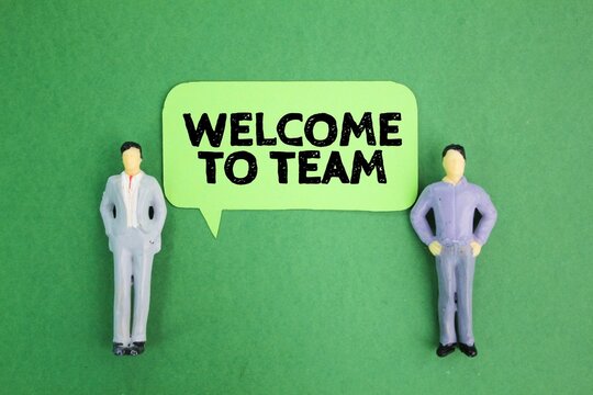 Two Miniature People And A Conversation Bubble With The Words WELCOME TO THE TEAM. Join The Group Concept