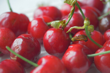 ripe fresh cherry on a white tray 