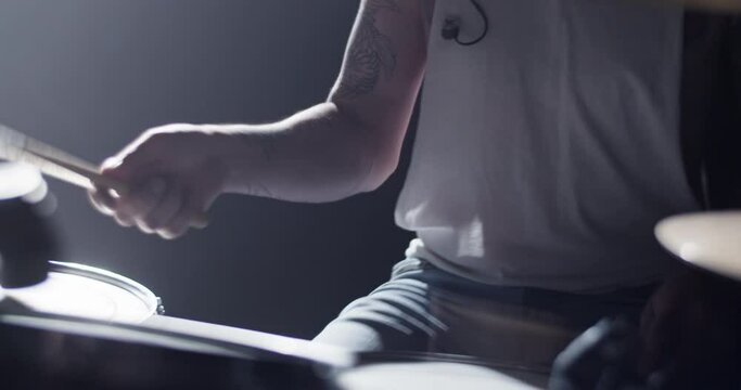 Man with drum kit playing music