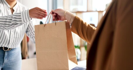 Woman, fashion designer and paper bag to customer in small business, purchase or buying at boutique store. Closeup of female person, hands and client buying clothing or shoes at retail shop or mall